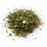 Pile of dried herbs (Break Dance Herbal Tea Blend) on a white background