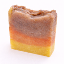 Three-layered soap bar with brown, orange, and yellow layers (Patricia's Lavender Rose Soap: Eczema & Sensitive Skin) on a white background