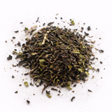 Pile of dried black tea leaves (Duke of Earl: Black Tea Blend) on a white background