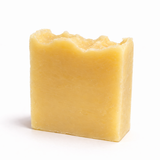 Yellow bar of soap (Ediza's Shampoo Bar) on a white background