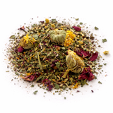 Heap of dried herbs and flowers (Esha's Essence: Herbal Tea Blend) on a white background