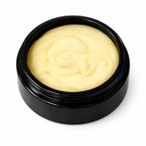 Black container with beige cream (Gettin' Pitted) on a white background