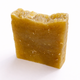 Block of beeswax (Oddie's Oatmeal Honey Soap) on a white background