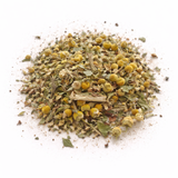 Heap of dried herbs and flowers (Snake Charmer: Herbal Tea Blend) on a white background