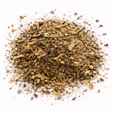 Pile of dried herbs (Time to Groove: Green Tea Blend) on a white background